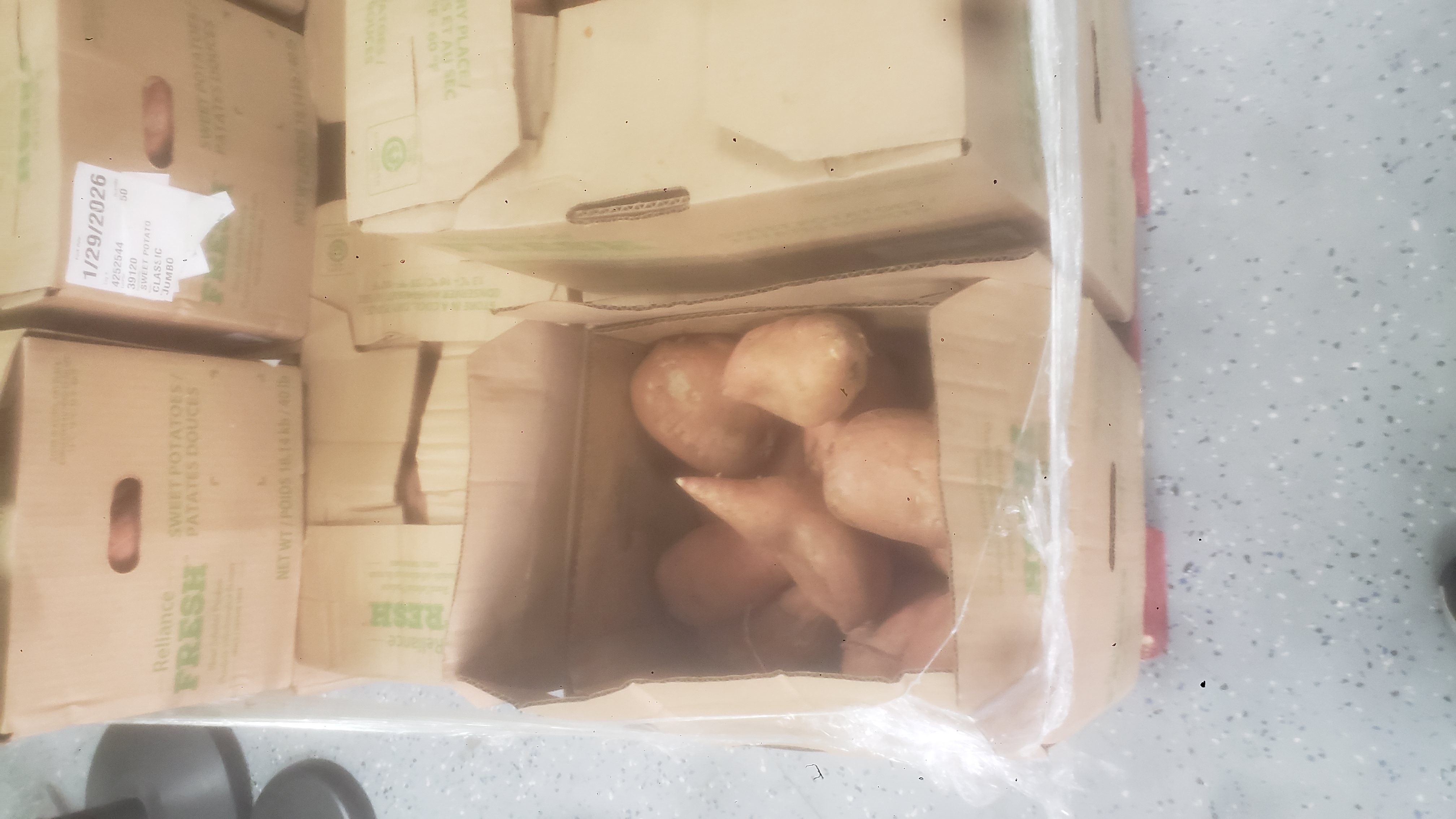 Boxes of sweet potatoes.